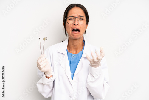 Konstfotografi hispanic pretty woman looking desperate, frustrated and stressed