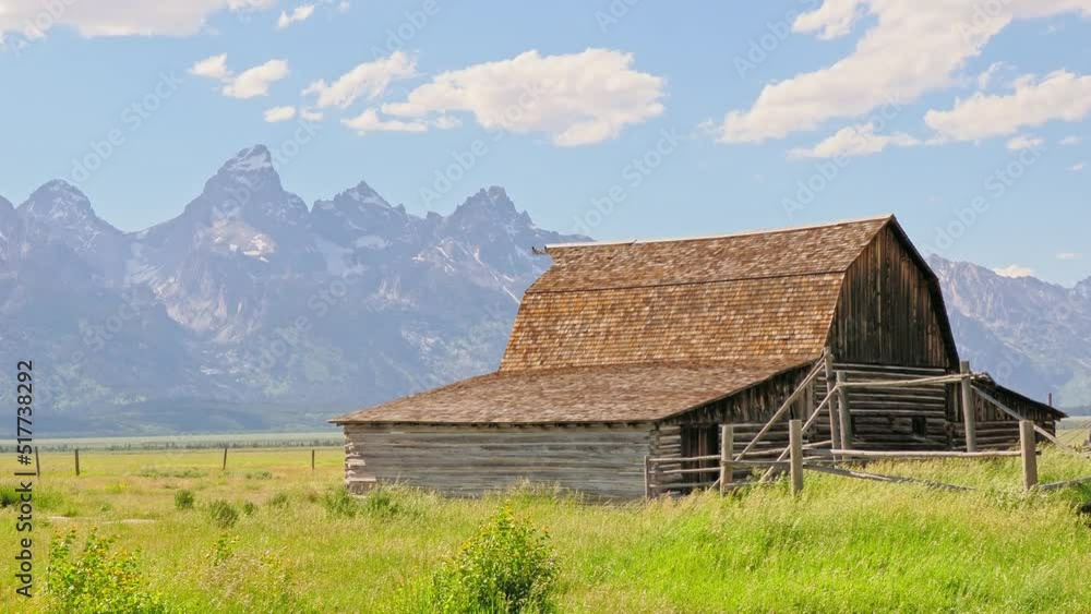 Sunny view of the John Moulton Barn and Teton Range Sunny view of the John Moulton Barn and Teton Range