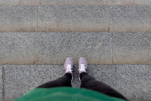 Картината върху платно cropped image of female legs in shoes