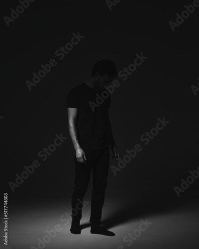  Portrait of a man in a dark key in the studio © Алексей Василюк