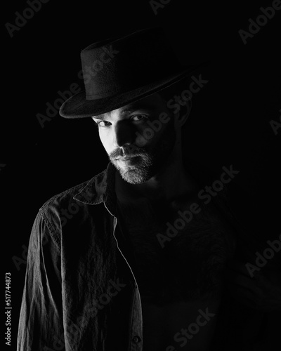  Portrait of a man in a dark key in the studio
