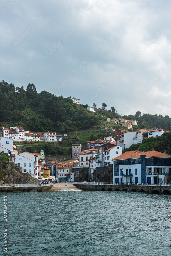 Coastal town near rippling sea Coastal town near rippling sea