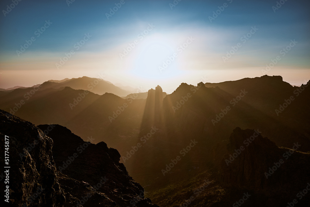 Rocky mountains against bright sunlight Rocky mountains against bright sunlight