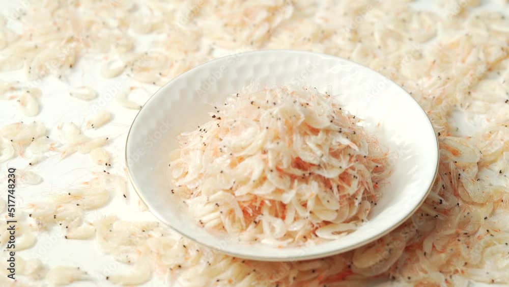 Seafood condiment dried shrimp skin on solid color background Seafood condiment dried shrimp skin on solid color background
