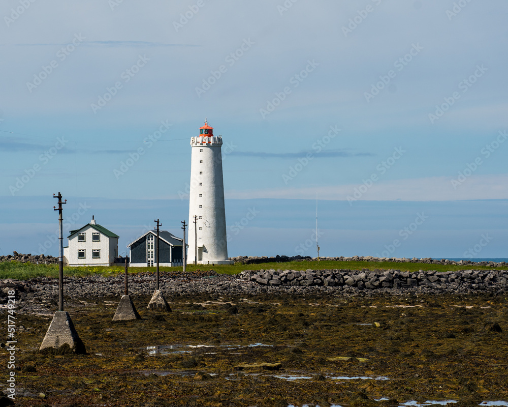 Seltjarnarnes, Iceland - July 1, 2022 Horizontal view of the Grótta Island Lighthouse. Located on a tied island at the extreme end of Seltjarnarnes in the Capital Region of Iceland