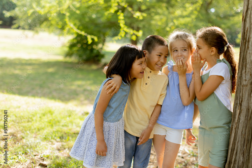 Group of asian and caucasian kids having fun in the park Group of asian and caucasian kids having fun in the park