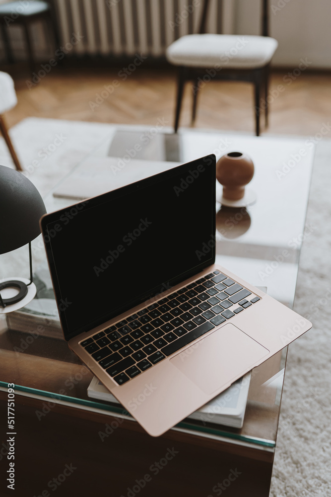 Laptop computer with blank screen on wooden table with lamp. Aesthetic ...
