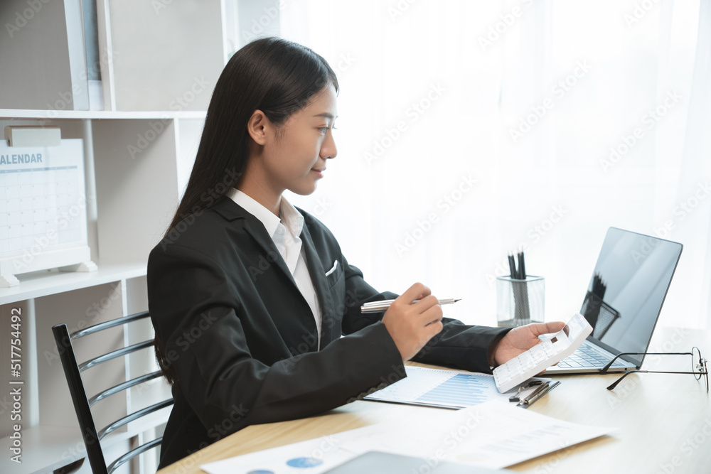 Financial inspector calculating a numbers in office room. Financial inspector calculating a numbers in office room.