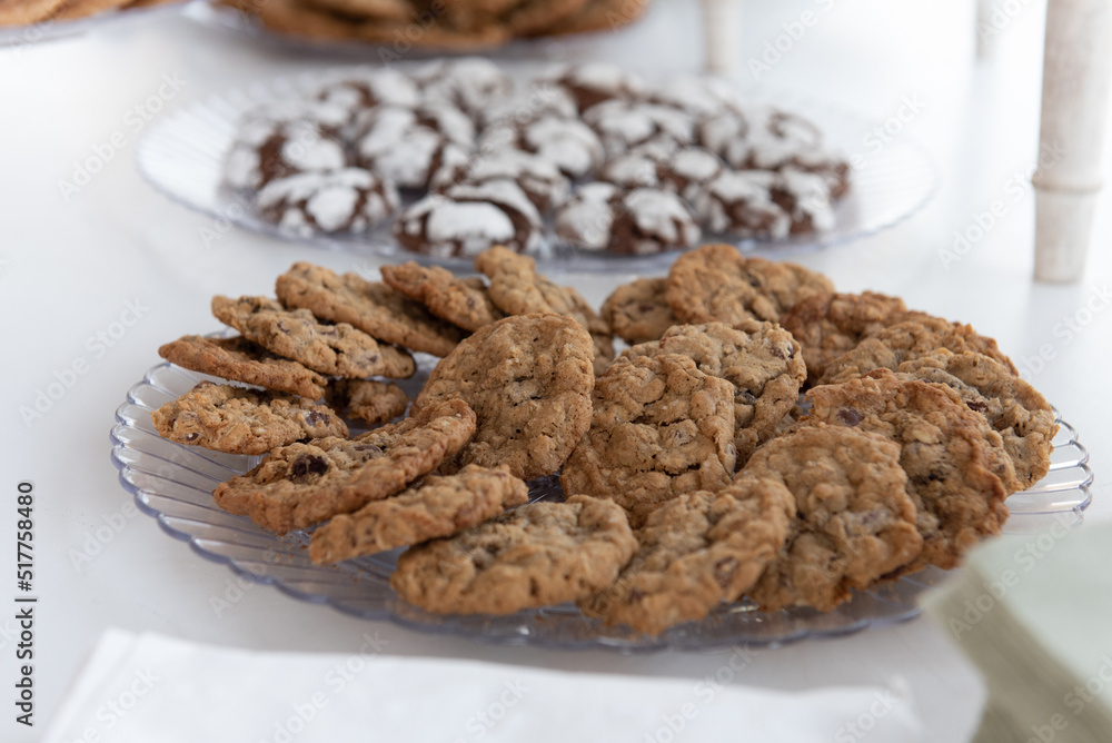 Delicious serve yourself offering of chocolate chip cookies on a plate for all the wedding guests to eat after dinner Delicious serve yourself offering of chocolate chip cookies on a plate for all the wedding guests to eat after dinner
