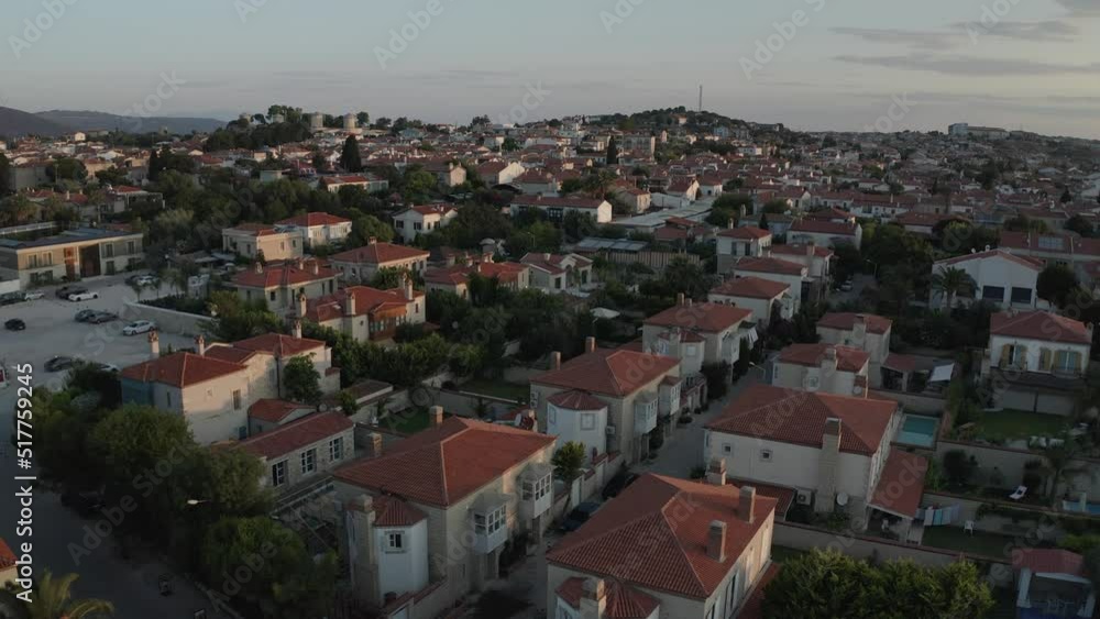 Sunrise aerial drone view of famous Turkish city Alacati near Cesme showing cobblestone streets and traditional houses of Turkey. Early morning sunlight captured in 4k drone Sunrise aerial drone view of famous Turkish city Alacati near Cesme showing cobblestone streets and traditional houses of Turkey. Early morning sunlight captured in 4k drone