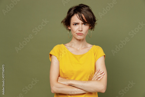 Konstfotografi Young frowning dissatisfied sad unhappy woman she 20s wear yellow t-shirt look c