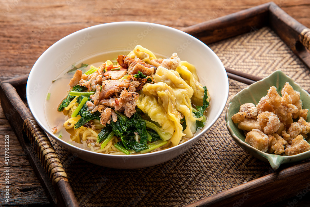 Chinese wonton soup noodle. egg noodles with pork wonton or pork dumplings Asian food concept style. Chinese wonton soup noodle. egg noodles with pork wonton or pork dumplings Asian food concept style.