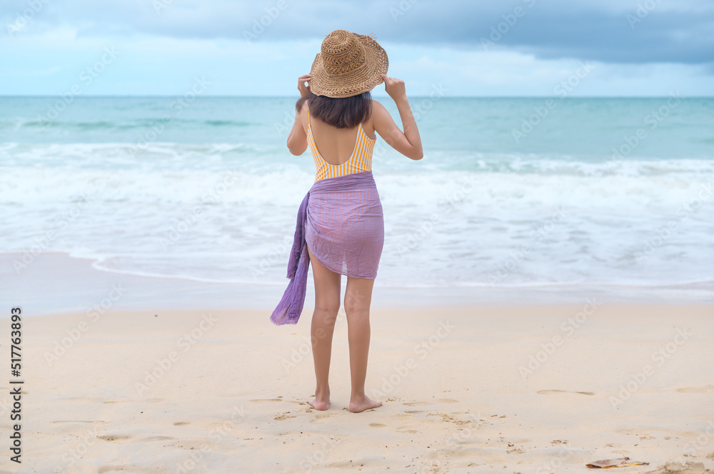 Young Beautiful woman in Bikini enjoying and relaxing on the beach, Summer, vacation, holidays, Lifestyles concept. Young Beautiful woman in Bikini enjoying and relaxing on the beach, Summer, vacation, holidays, Lifestyles concept.