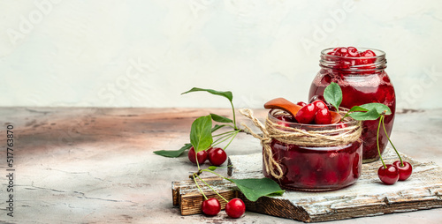 Berries cherry with syrup. Berries cherry with syrup. Canned fruit on a light background. Long banner format © Надія Коваль
