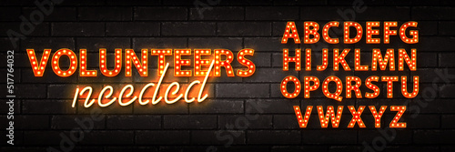 Vector realistic isolated retro marquee billboard with electric light lamps of Volunteers Needed logo with alphabet font on the wall background.