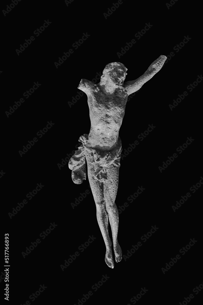 Very ancient destroyed iron statue of crucifixion of Jesus Christ. Black and white image.
