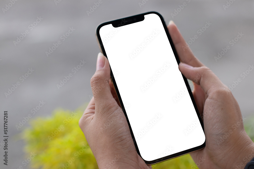 Mockup of a woman browsing on to a white blank smartphone