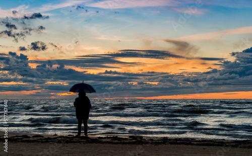 Colorful sunset on sandy beach of the Baltic Sea in Jurmala - famous tourist ...