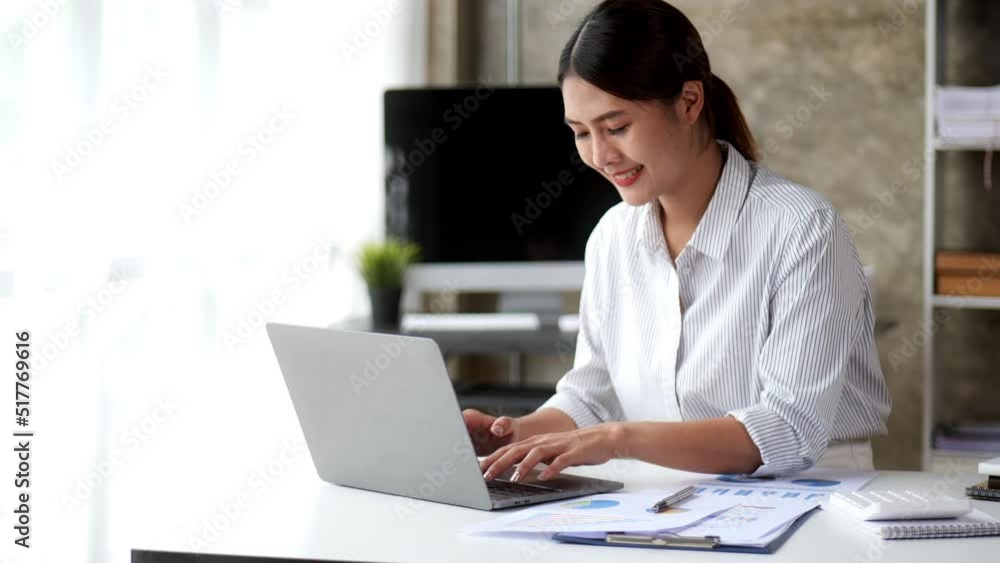 Beautiful business woman is study and working on paperworks and laptop at home. Beautiful business woman is study and working on paperworks and laptop at home.