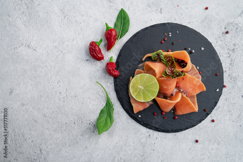Fresh salmon slices with pe...