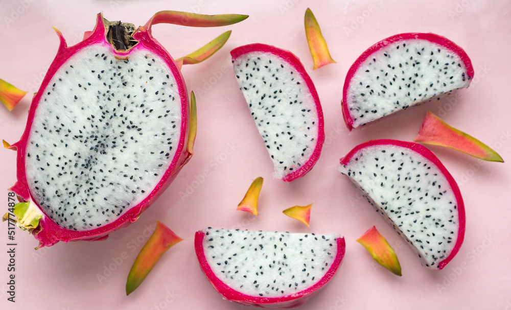 PITAHAYA OR DRAGON FRUIT, WHITE CUT OUT, ON PINK BACKGROUND PITAHAYA OR DRAGON FRUIT, WHITE CUT OUT, ON PINK BACKGROUND