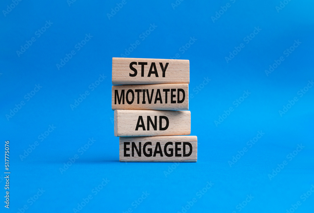 Stay Motivated and Engaged symbol. Concept words Stay Motivated and Engaged on wooden blocks. Beautiful blue background. Business and Stay Motivated and Engaged concept. Copy space Stay Motivated and Engaged symbol. Concept words Stay Motivated and Engaged on wooden blocks. Beautiful blue background. Business and Stay Motivated and Engaged concept. Copy space