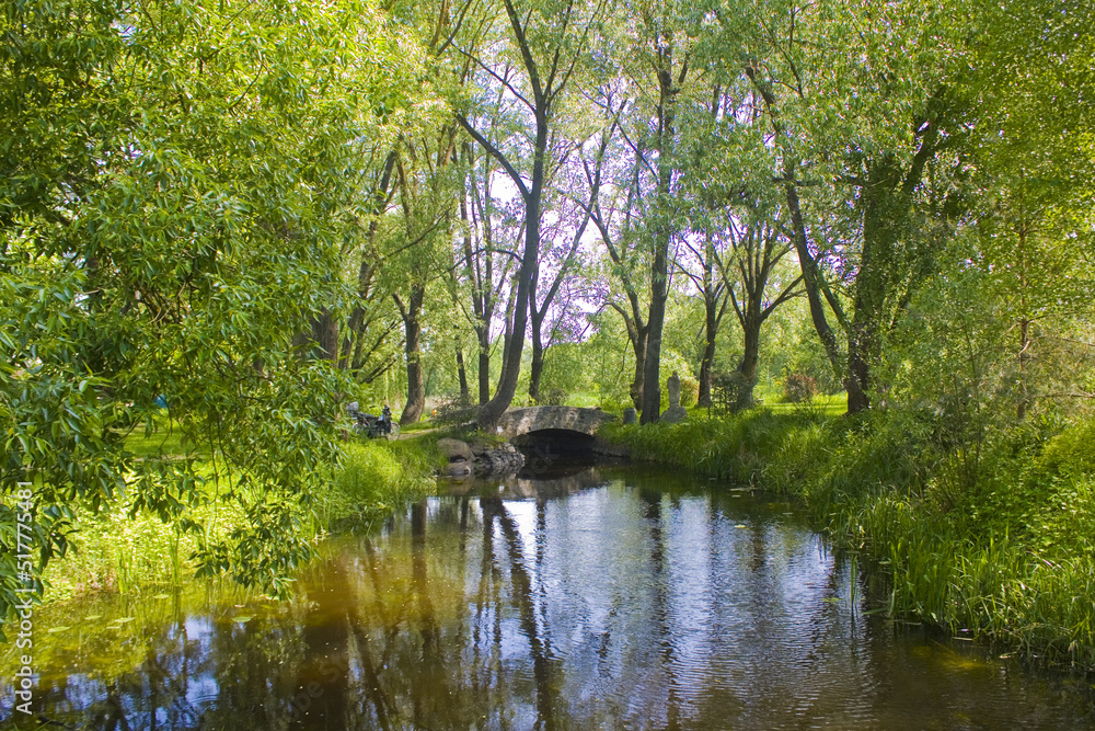 Park with a river near Radomysl Castle in Ukraine	
