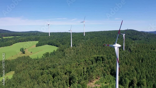 Aerial video of wind power plant on the hilltop between fir trees. St. Peter, Black forest, Germany.
Concept  for regenerative energy and energy crisis.