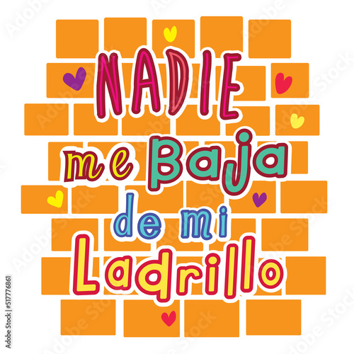 cute hand-written lettering in the Spanish language. Traduction of the graffiti on the wall “no one gets me off my brick.