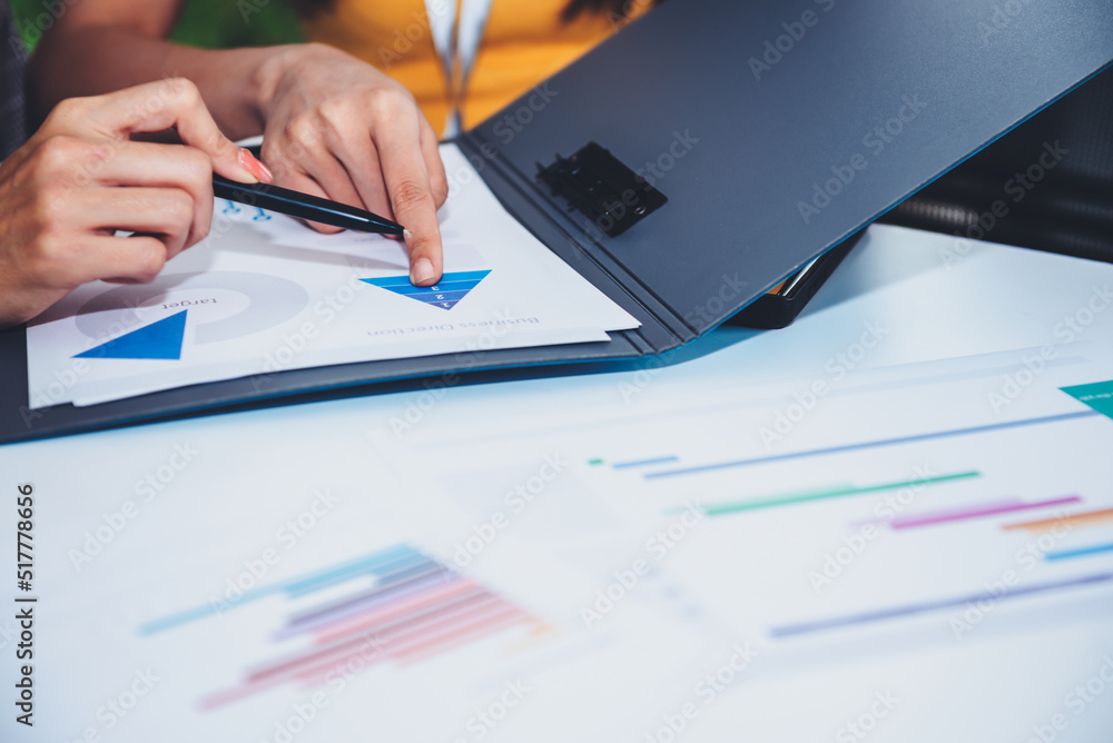 2 business women consulting, analyzing plans and plan work together by using data from paper graphs, to business people and start up concept. 2 business women consulting, analyzing plans and plan work together by using data from paper graphs, to business people and start up concept.
