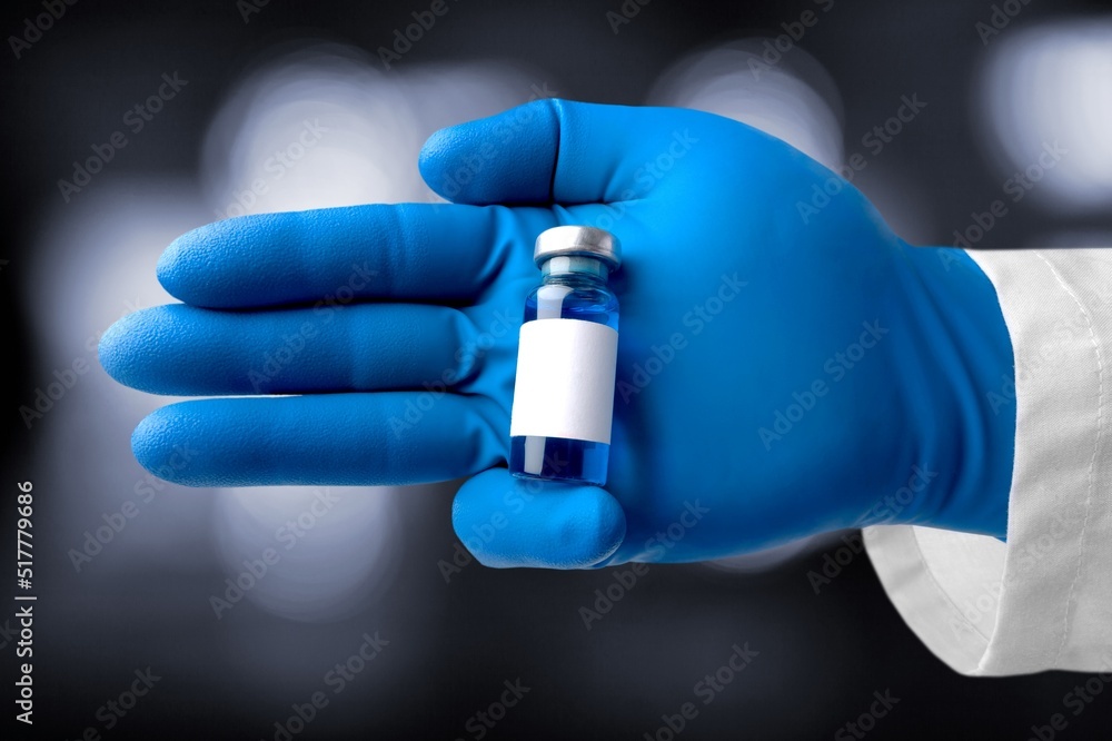A vial of vaccine for Monkeypox virus, on outdoor background - obrazy, fototapety, plakaty 