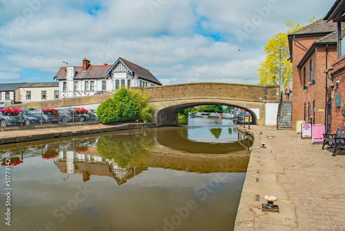 A bright sunny morning on the Leeds-Liverpool canal near Burscough with beautiful reflections photo