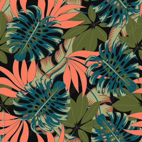 Fashionable seamless tropical pattern with bright plants and leaves on a dark...