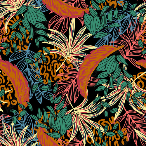 Fashionable seamless tropical pattern with bright plants and leaves on a blac...