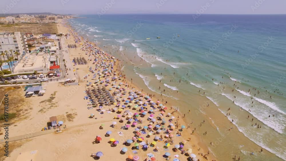 Aerial view of Torre La Mata beach, Alicante during sunny summer day. Costa Blanca. Spain. Travel and tourism concept. Cinematic 4K Aerial view of Torre La Mata beach, Alicante during sunny summer day. Costa Blanca. Spain. Travel and tourism concept. Cinematic 4K