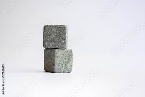 Two stone cubes one above the other