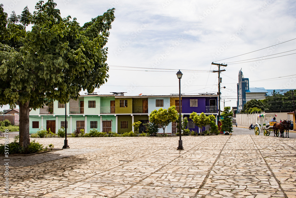 Naklejka premium Colorful Buildings with a Horse Drawn Carriage in Granada, Nicaragua 