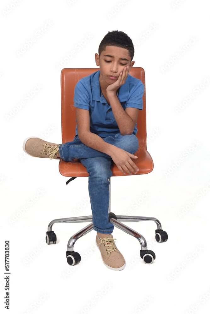 sad teen sitting on a chair on white background sad teen sitting on a chair on white background