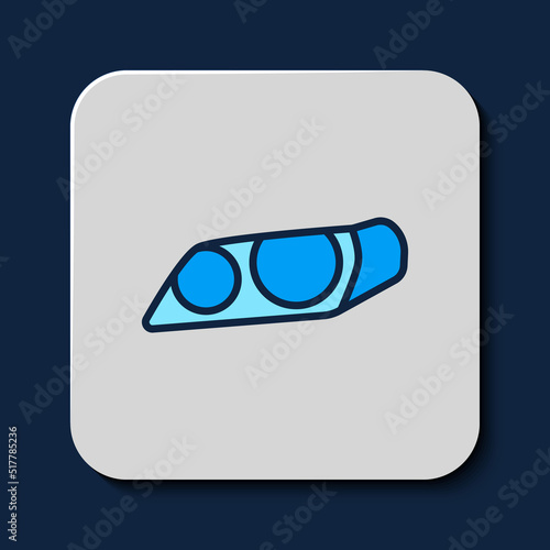 Filled outline Car headlight icon isolated on blue background. Vector