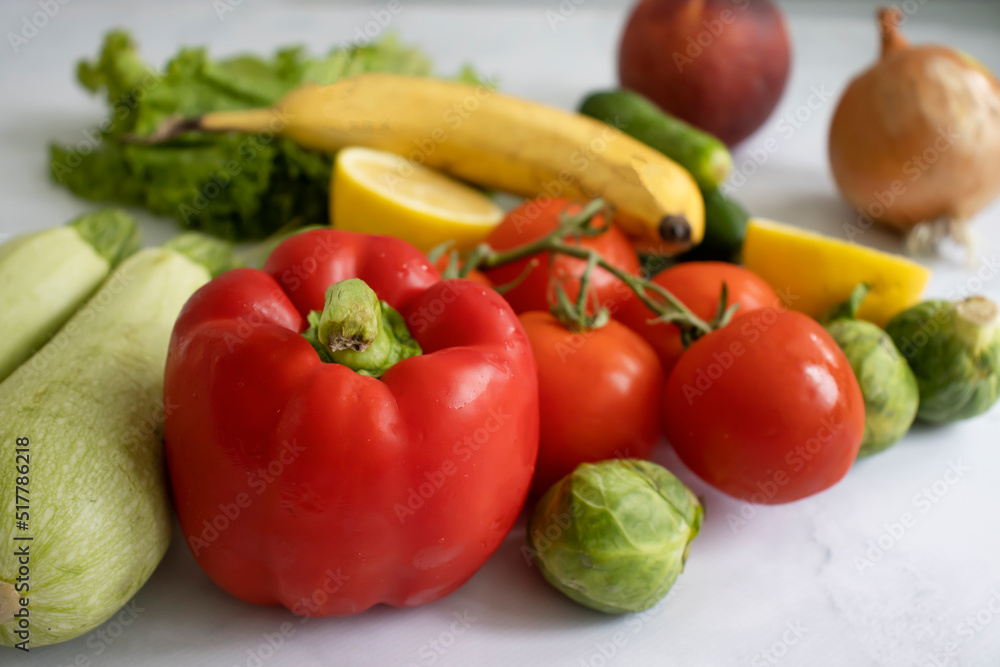 Various fruits and vegetables on a light background