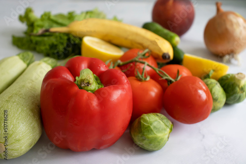 Various fruits and vegetables on a light background