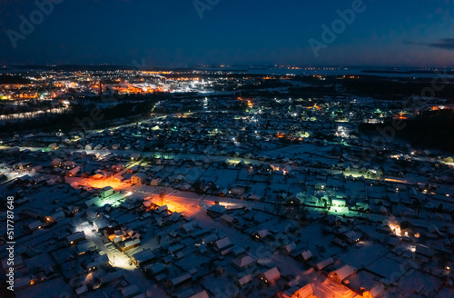 Aerial View Of Town Skyline Winter Night. Snowy Landscape Cityscape Skyline. photo