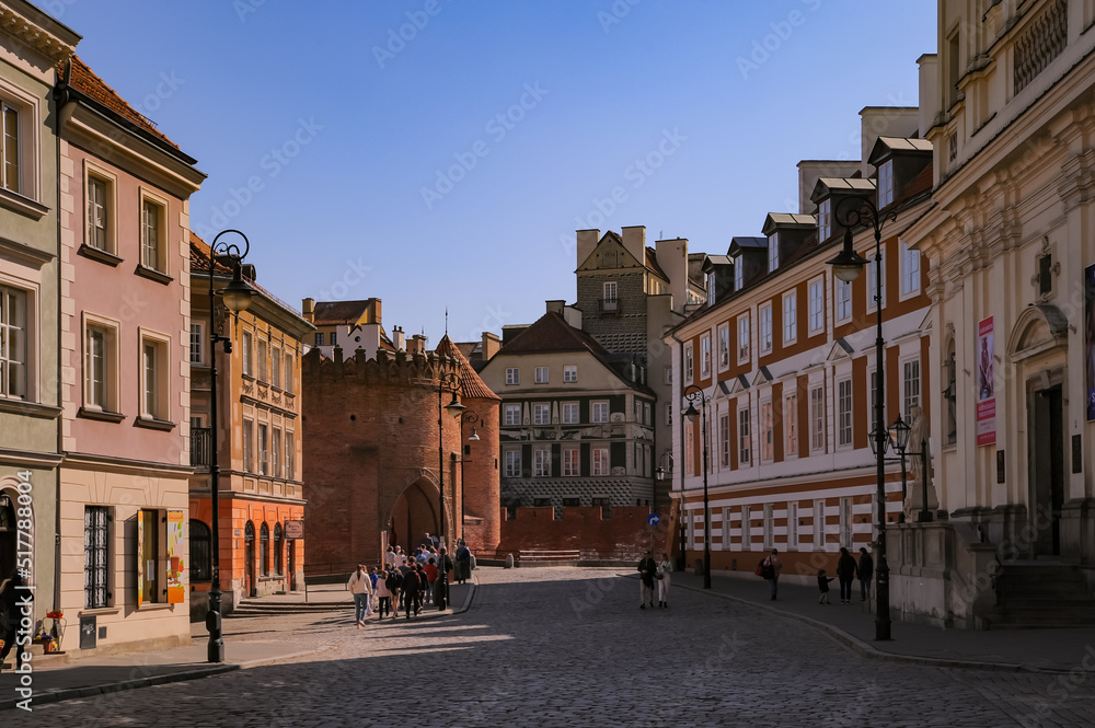 WARSAW, POLAND - MARCH 22, 2022: Beautiful view of Old Town Square on sunny day