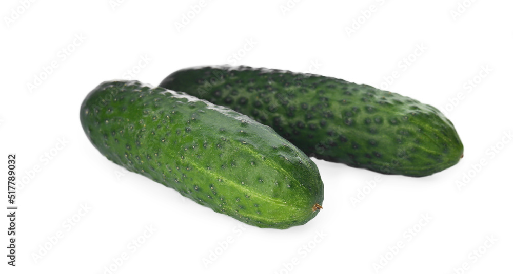 Whole fresh green cucumbers on white background Whole fresh green cucumbers on white background