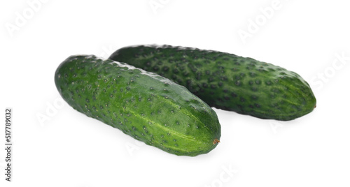 Whole fresh green cucumbers on white background