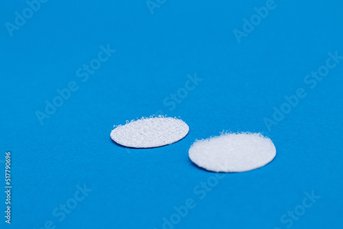 Bild auf Leinwand Hook-and-loop fastener white Velcro in closeup on blue background
