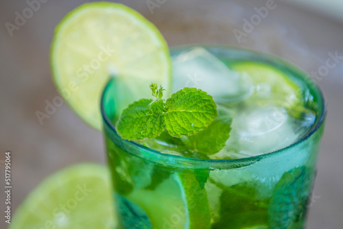 glass of mojito, tropical drink with mint and brown sugar