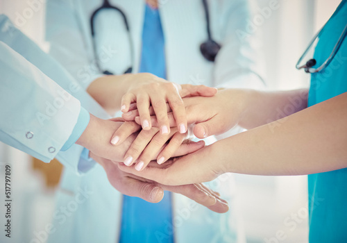 Group of doctors putting their hands together. Close-up