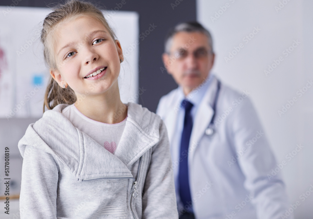 Portrait of a cute little girl and her doctor at hospital Portrait of a cute little girl and her doctor at hospital