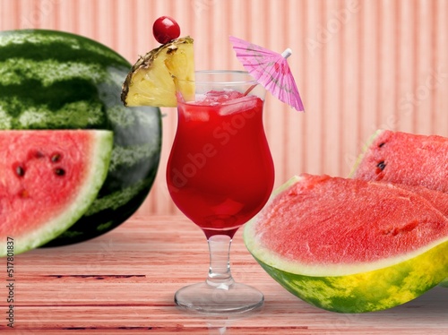 Tasty ripe fresh watermelon juice or smoothie in glasses with watermelon pieces. Refreshing summer drink